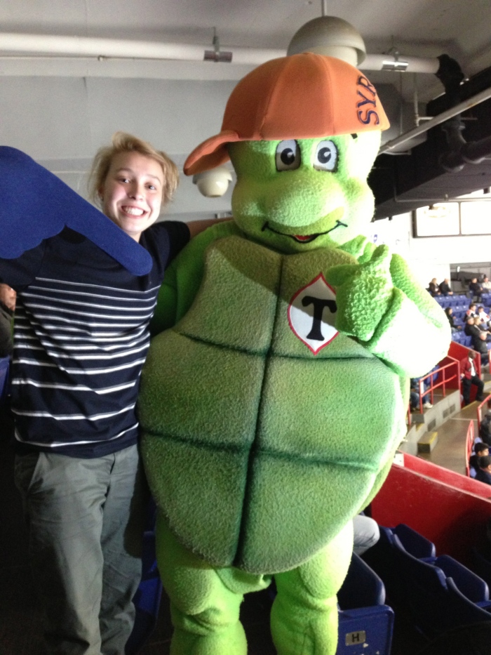 Nicki C. in the stands with the turtle mascot