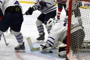 Ashley Davis tracks the puck for a save